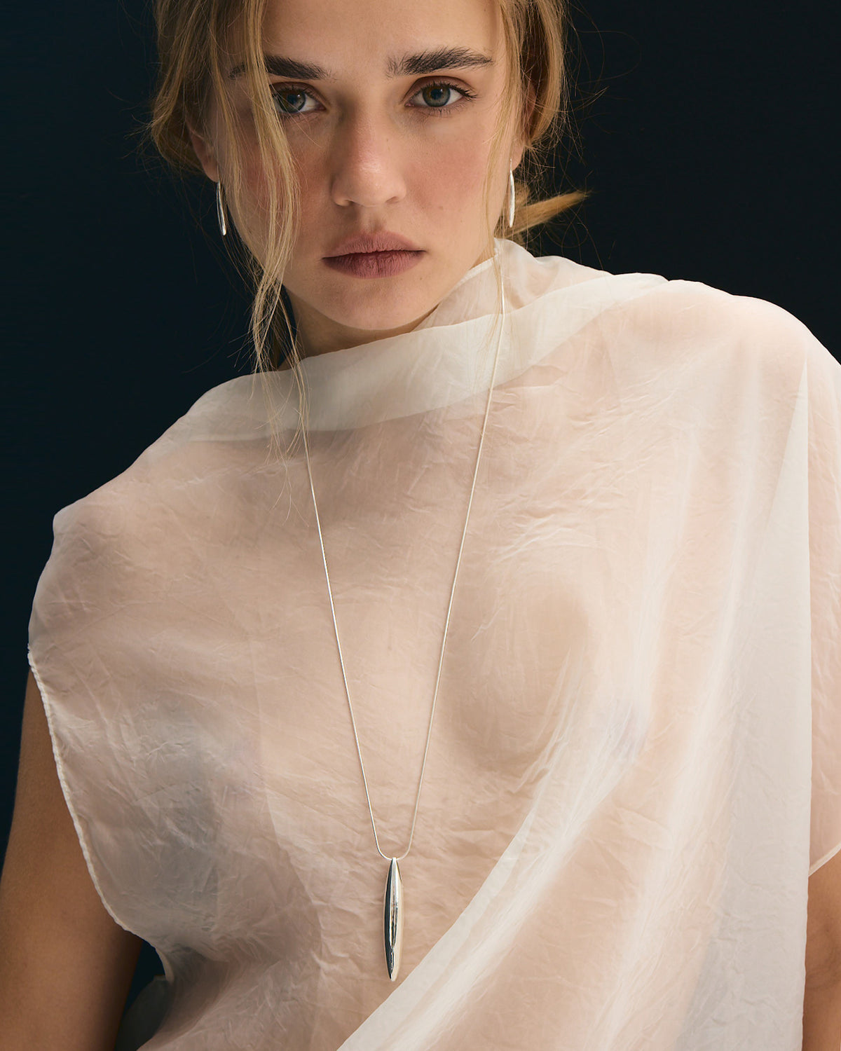 Ina large necklace